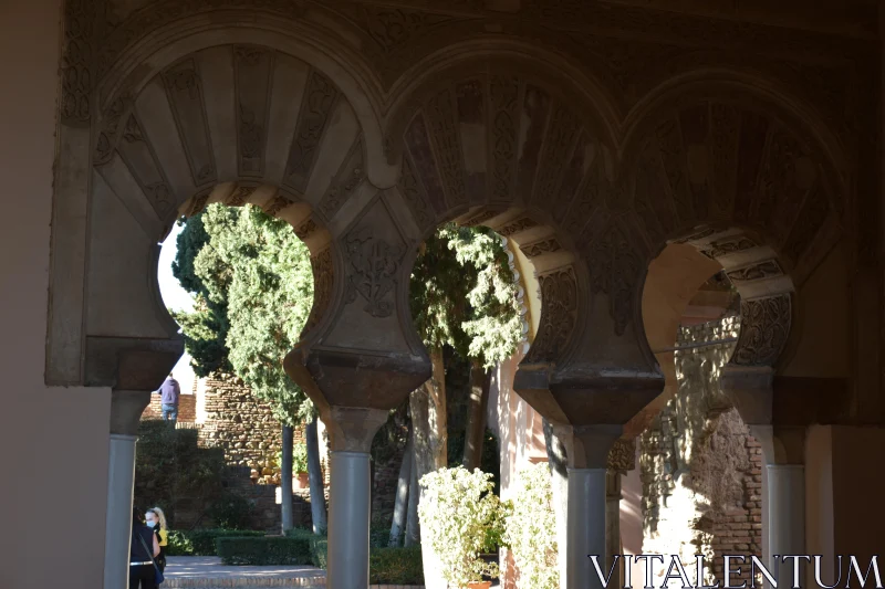 PHOTO Ornate Stone Archway with Garden View