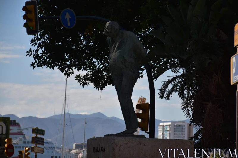 PHOTO Statue and Mountains in Málaga