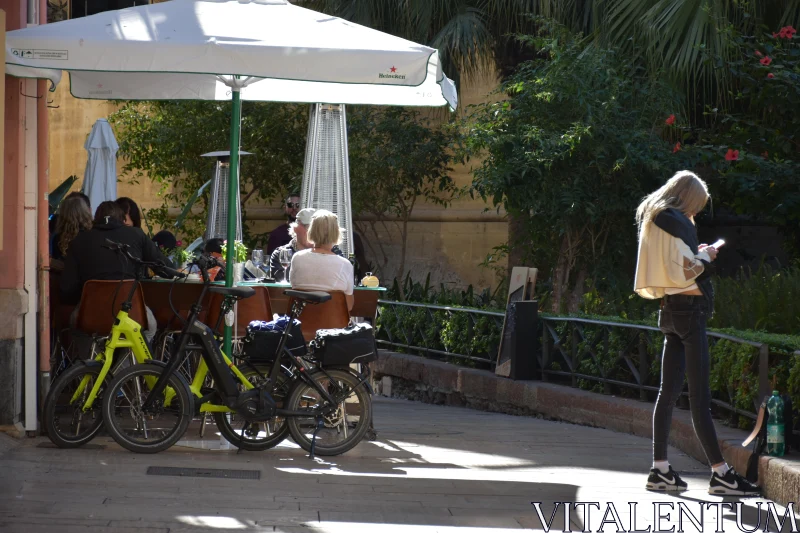 PHOTO Street Cafe with Parked Bicycles