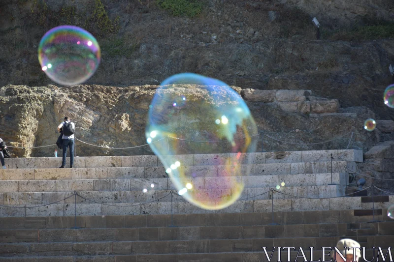 Vibrant Bubbles in an Urban Amphitheater Free Stock Photo