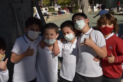 Children Bonding Outdoors with Masks