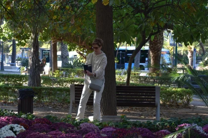 Woman in Park with Autumn Foliage