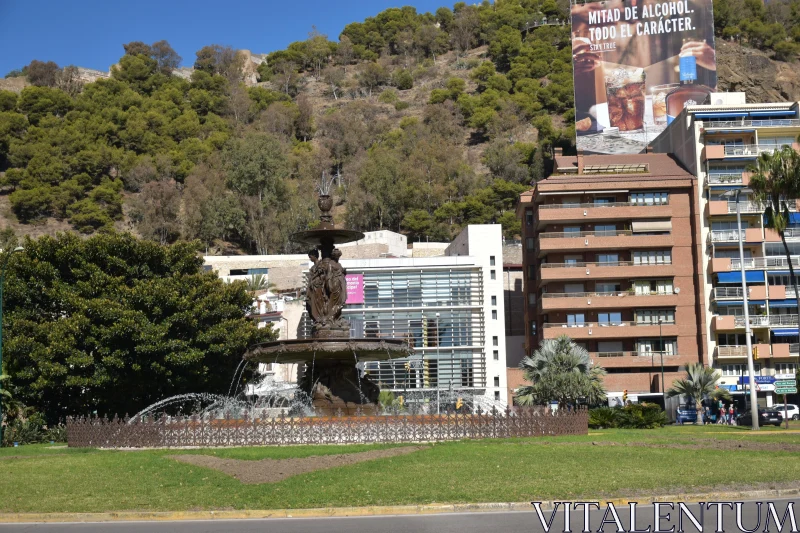 City Fountain and Buildings Free Stock Photo