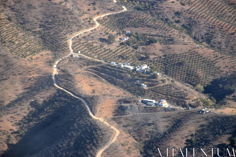 Aerial View of Mediterranean Terrain with Winding Path Free Stock Photo