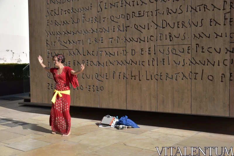 Street Performer Dancing in Red Free Stock Photo