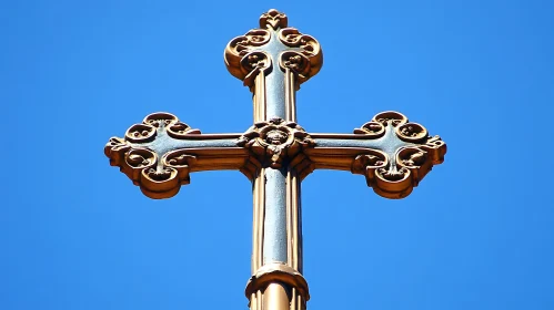 Elaborate Golden Cross on Clear Day