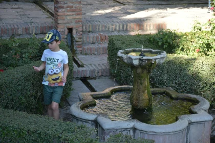 Tranquil Garden with Child and Fountain