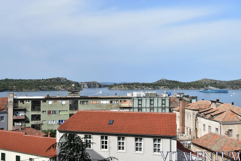 Coastal Cityscape with Rooftops and Hills Free Stock Photo