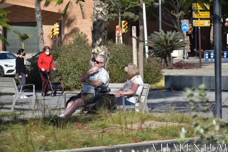 PHOTO City Park Relaxation with Greenery and Walkers