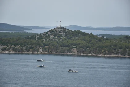 Calm Waters and Boats Near Island