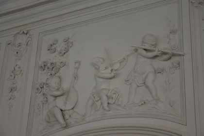 Cherubs with Instruments: A Detailed Relief