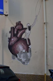 Graffiti of Human Figure and Heart Symbol