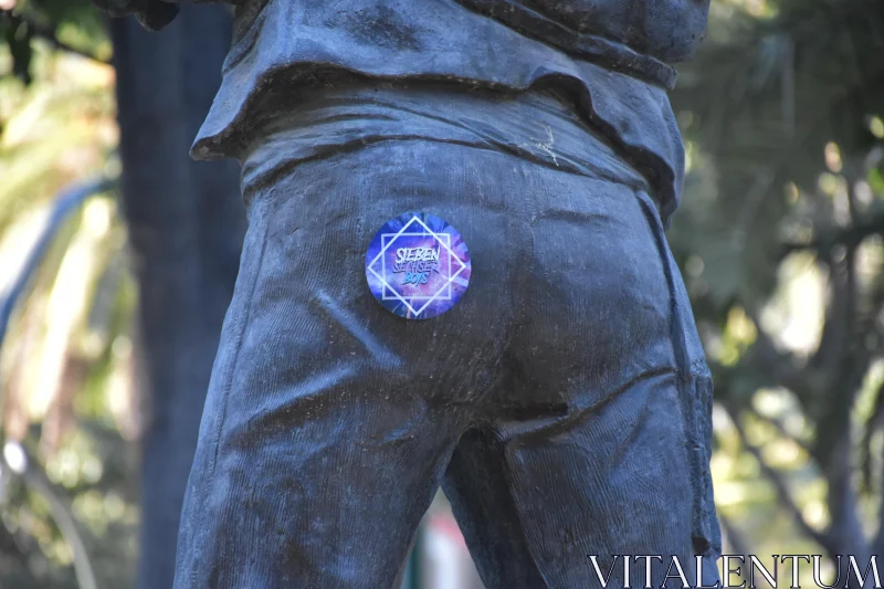 PHOTO Sticker Adorned Statue Close-Up