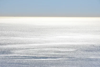 Peaceful Beach with Glimmering Sea