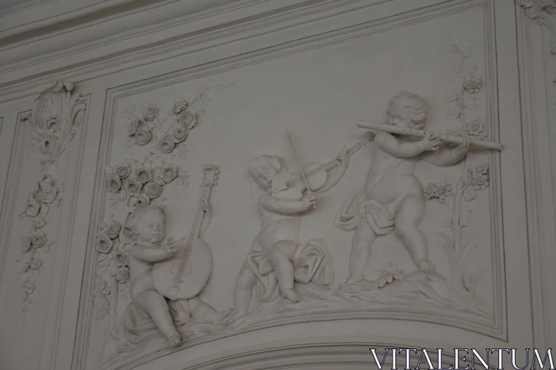 PHOTO Cherubs with Instruments: A Detailed Relief