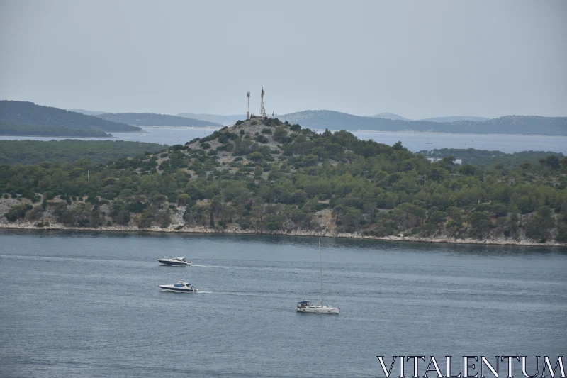 PHOTO Calm Waters and Boats Near Island