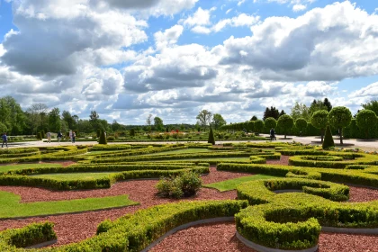 Intricate Garden Landscape with Clouds