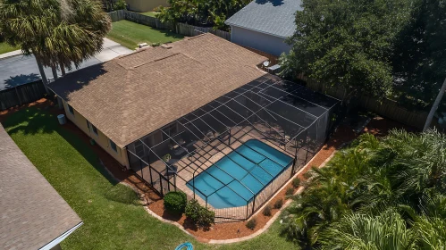 Backyard Screened Swimming Pool and House